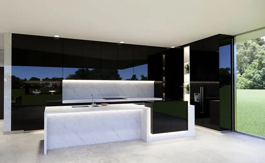 Modern kitchen black lacquer cabinets white quartz island with under cabinet lights