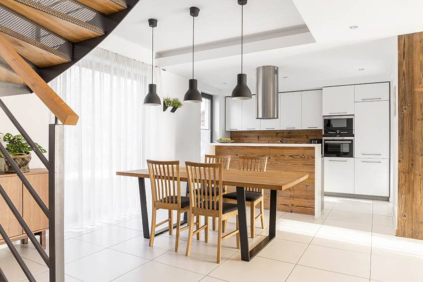 Modern kitchen with ceramic tile floors white cabinets wood island 