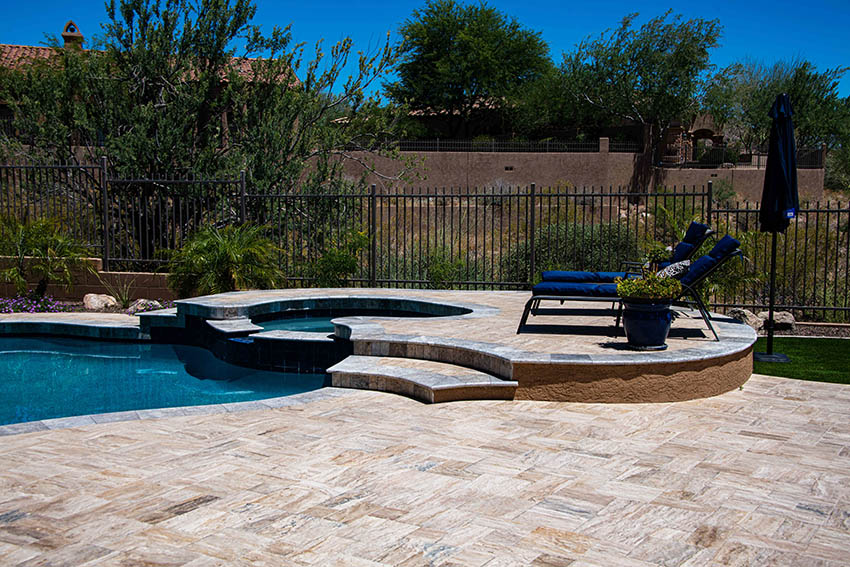 Travertine pool deck with raised sitting area