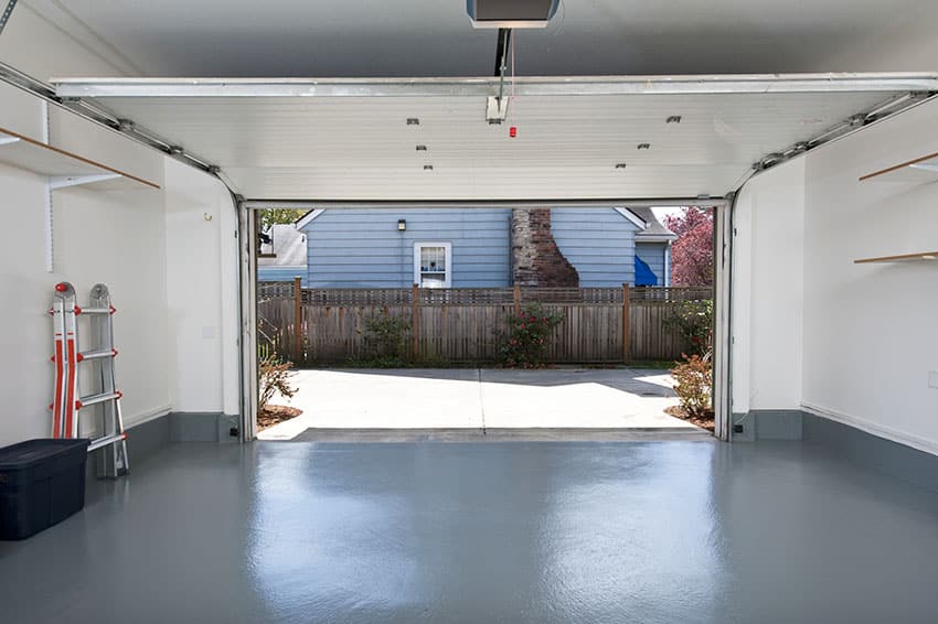 Interior garage with teal flooring light wall