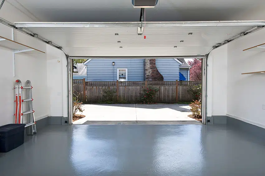 Interior garage with teal flooring light wall