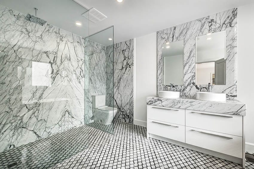 Bathroom with chain link style mosaic tile shower floor quartz walls glass enclosure