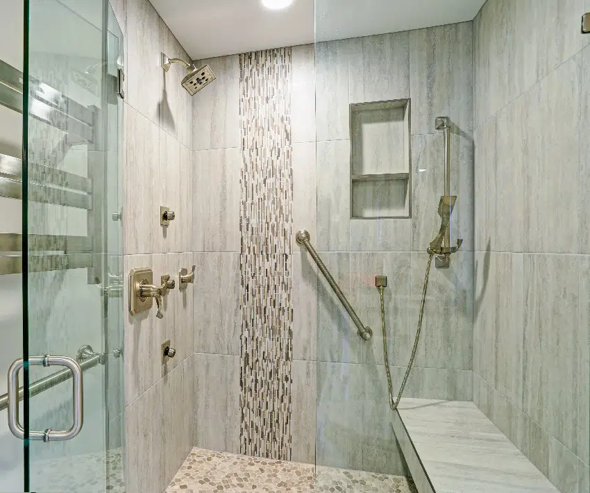 bathroom with walk in shower built in floating bench glass door and mosaic vertical stripe tiled