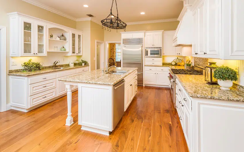 beautiful custom kitchen interior with marble countertop and wooden flooring