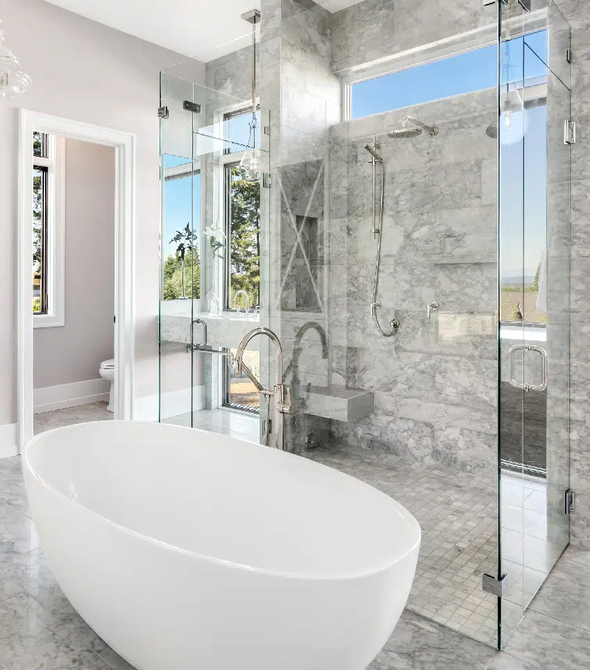 beautiful marble tiled bathroom with corner shower bench