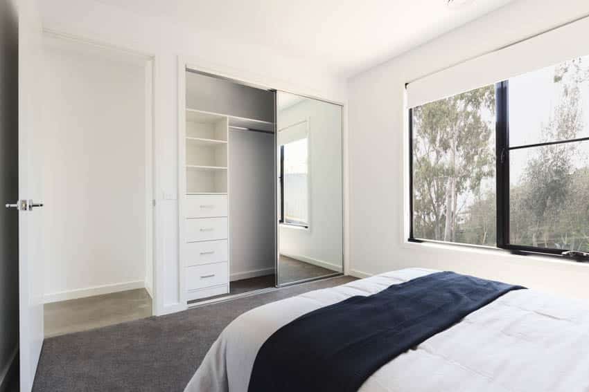 Bedroom sliding closet doors and carpet floor