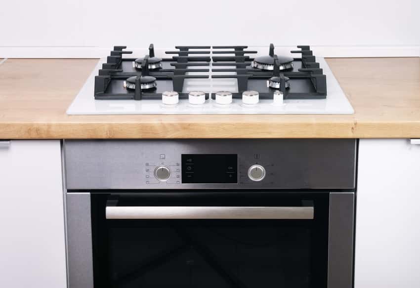 Close up partial view of a cooking range in a kitchen