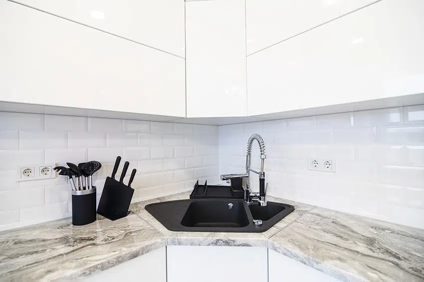 Corner kitchen sink with marble countertop white cabinet