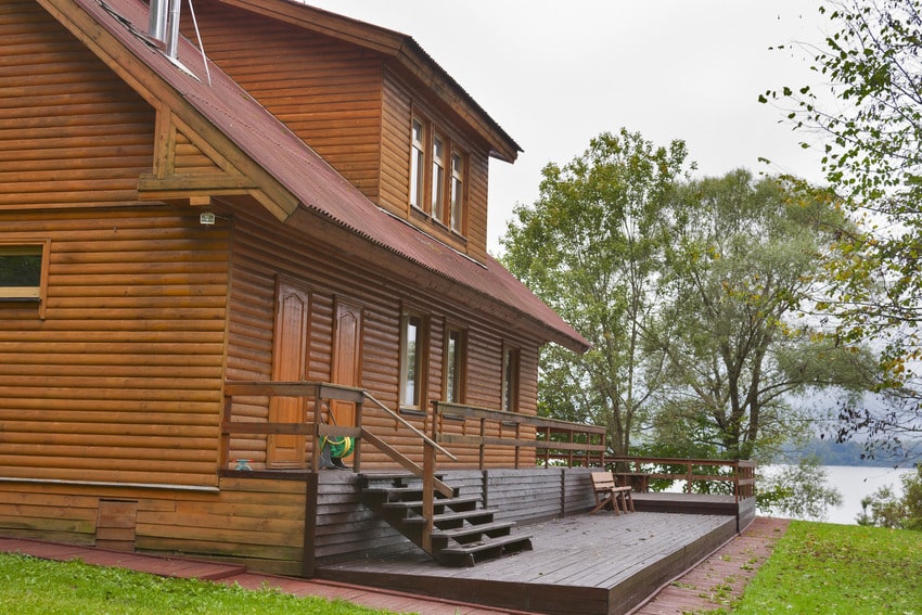 Country house with exterior wood siding close to lake