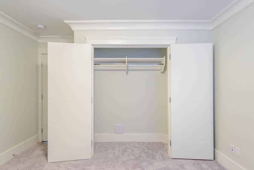 Empty reach in closet in bedroom