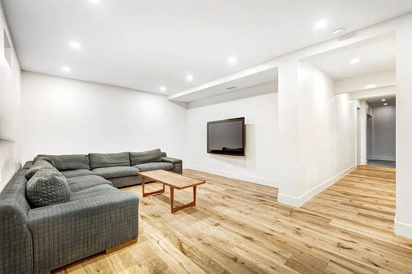Finished basement with sheetrock walls sectional sofa