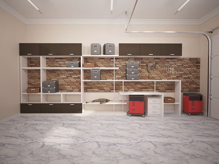 Garage with brick accent wall and shelving