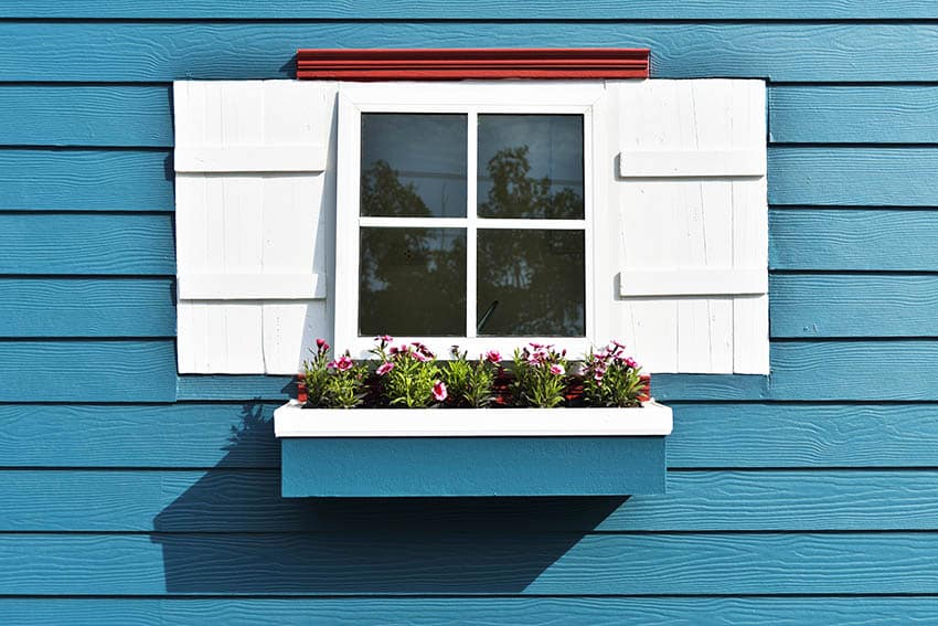 House exterior with blue paint and white shutters