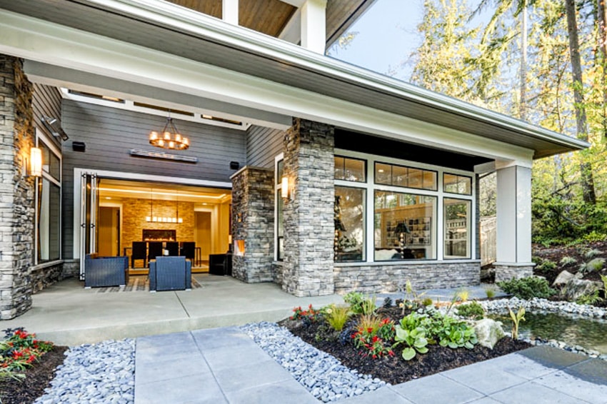 A folding patio, water pond, and outdoor furniture