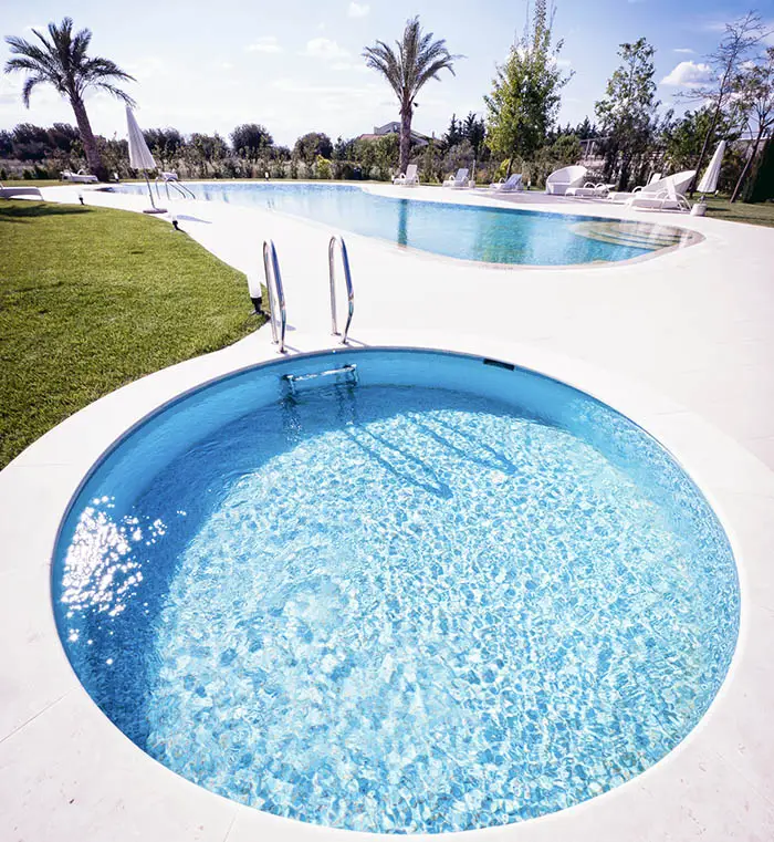 Large circular soaking pool next to rectangular pool