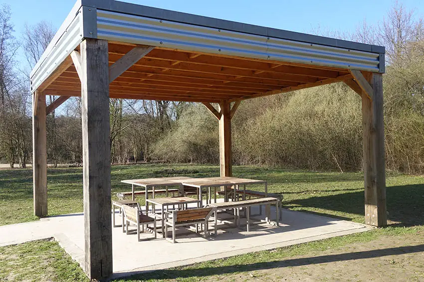 Large modern pavilion with concrete patio outdoor dining