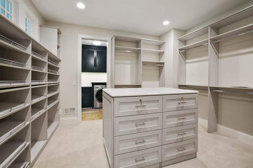 Light gray closet with island and drawers