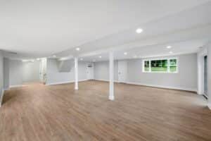 Light Grey Spacious Basement Area With Wood Flooring Ss 300x200 