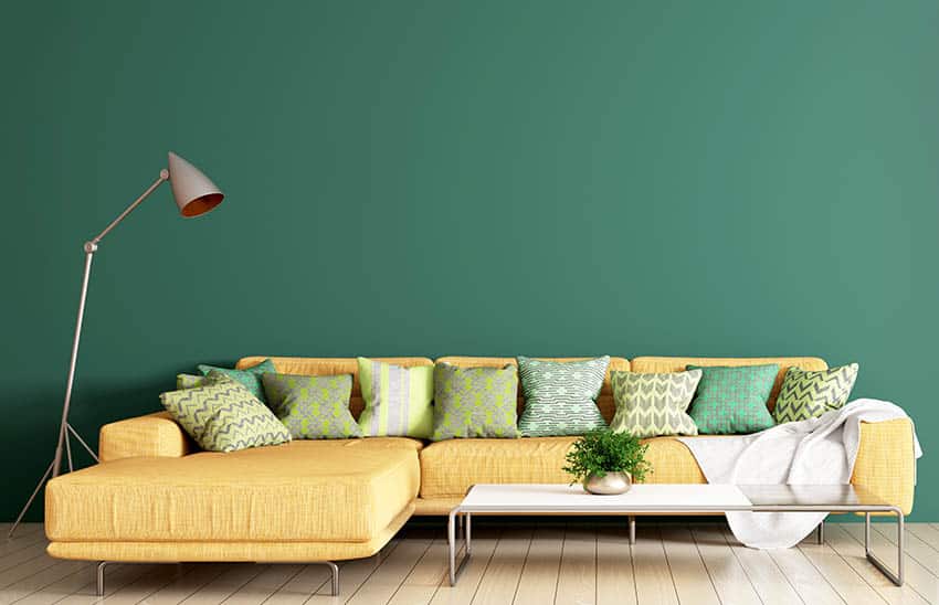 Living room with green interior paint large yellow sectional sofa