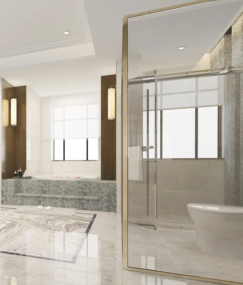 luxury modern design bathroom and toilet with marble tiles and glass shower stall