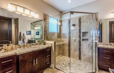 Master Bathroom With River Rock Shower Floor Dual Vanities Granite Countertops Is 364x236 