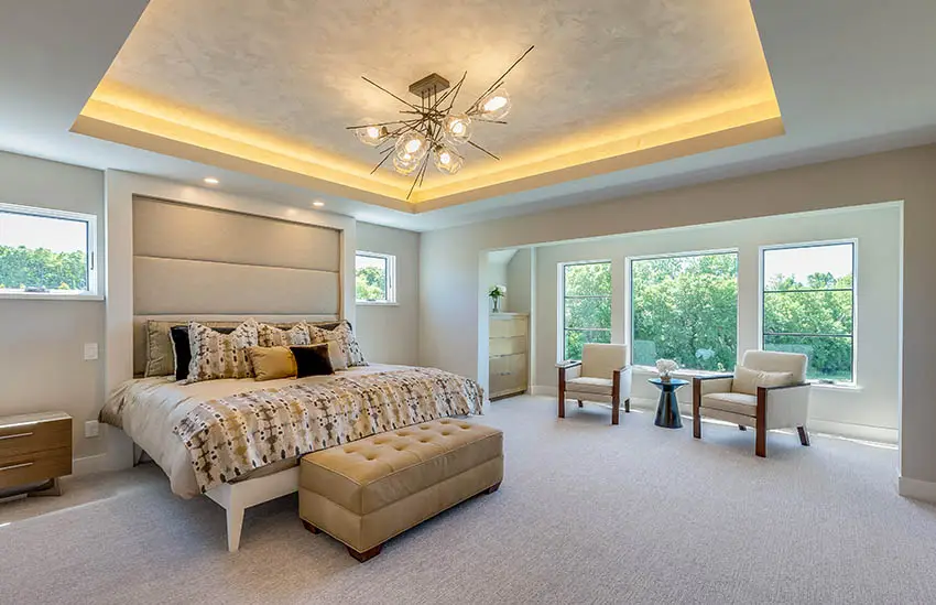 Master bedroom with indirect accent light tray ceiling platform bed