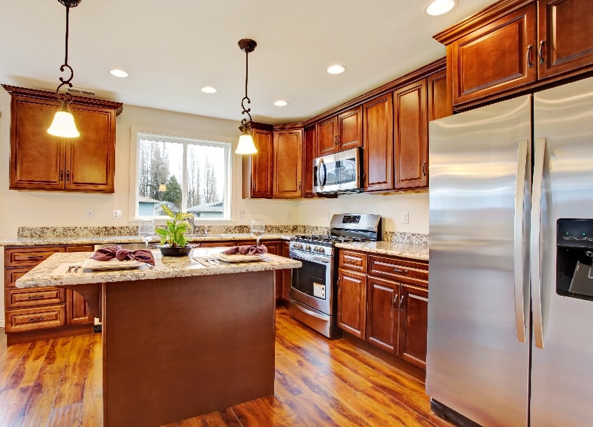 kitchen with hardwood floor dark oak wood cabinets and granite countertops