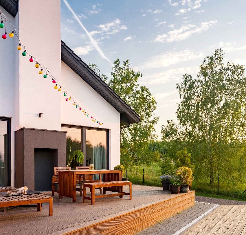 Nice view of villa with outdoor wooden deck patio 