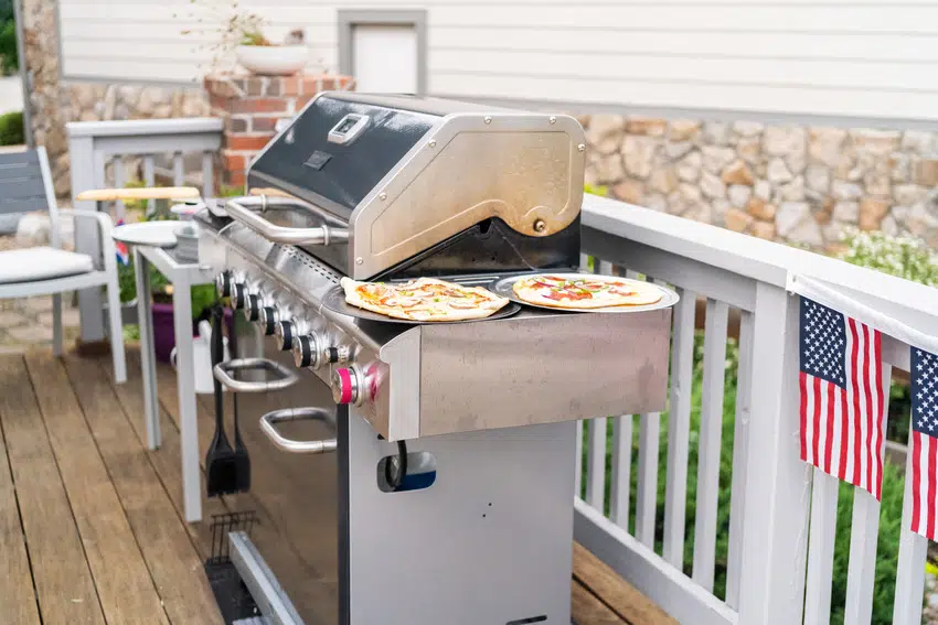 Outdoor kitchen with a stainless steel gas grill