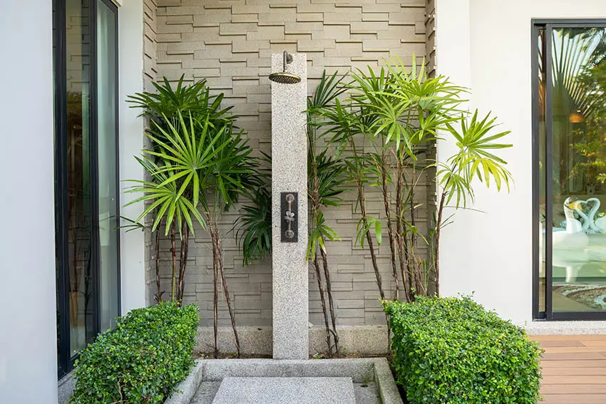 Outdoor shower with concrete floors