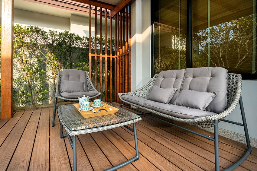 Patio with wooden floor and steel framed chairs
