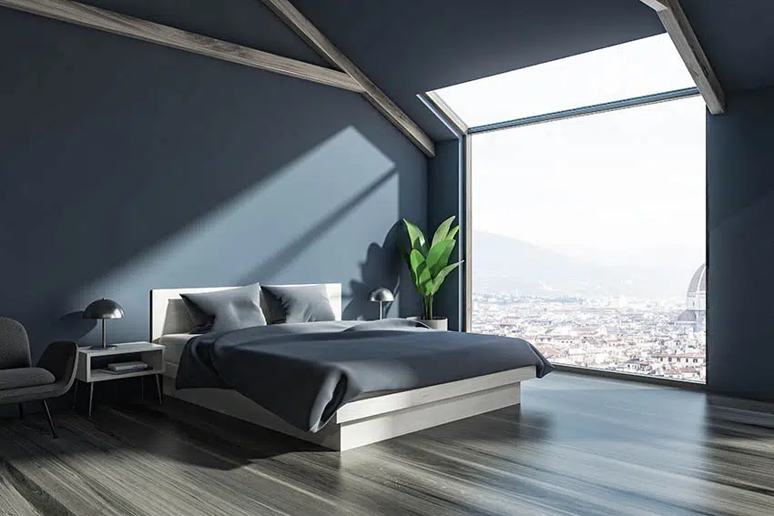 Penthouse bedroom with dark gray walls gray flooring