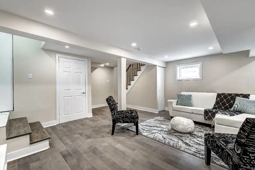 renovated modern stylish basement living room with wood tile flooring
