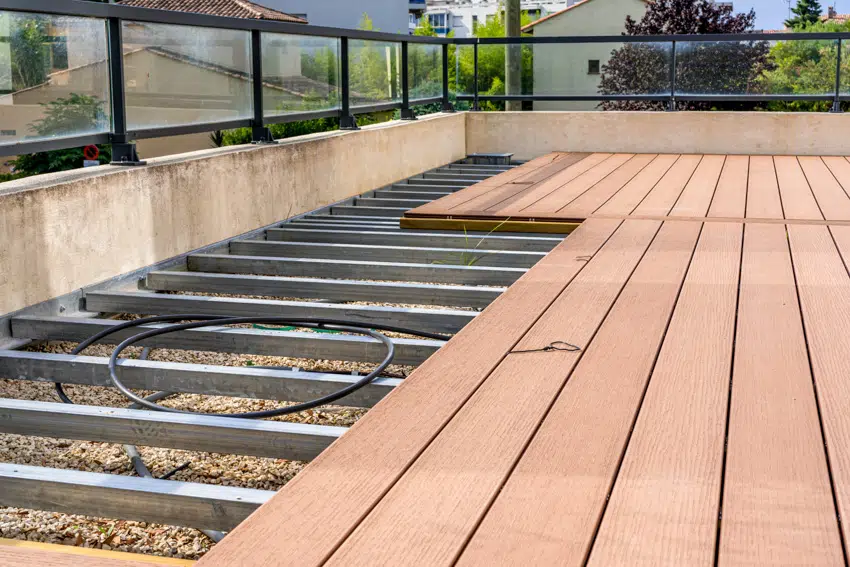 Steel bars underneath wood planks deck construction