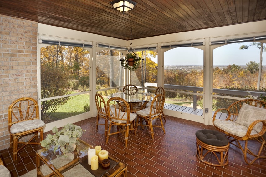 Sunroom with brick floor