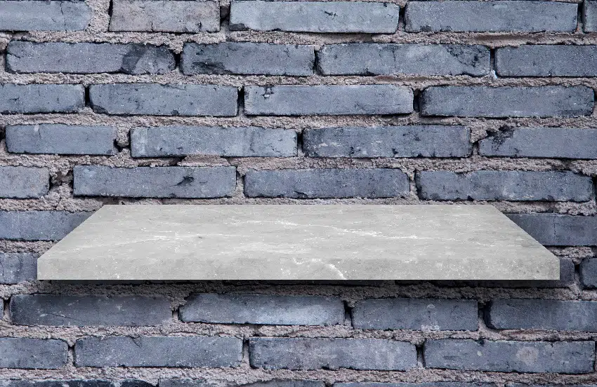 top shelf slab granite with brick wall