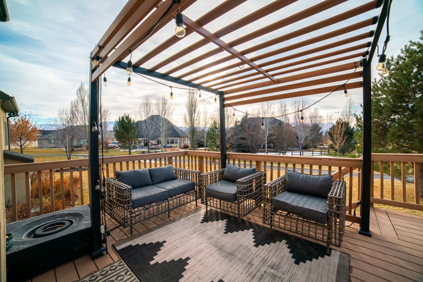 Wooden pergola on patio with string lights 