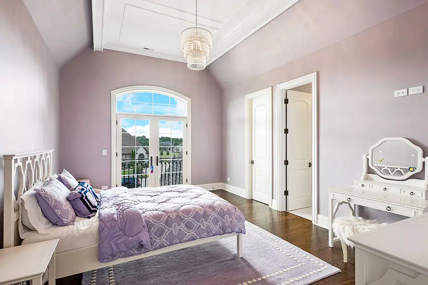 Bedroom with lavender paint french door chandelier