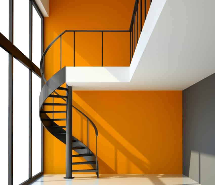 empty room with staircase and orange wall