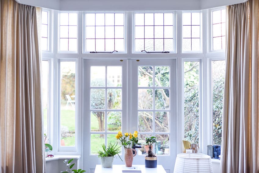 French door with decorative transom windows with curtains