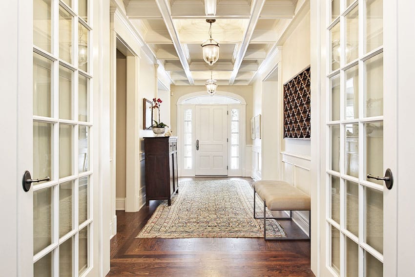 French doors in foyer with carpet wood floor conferred ceiling