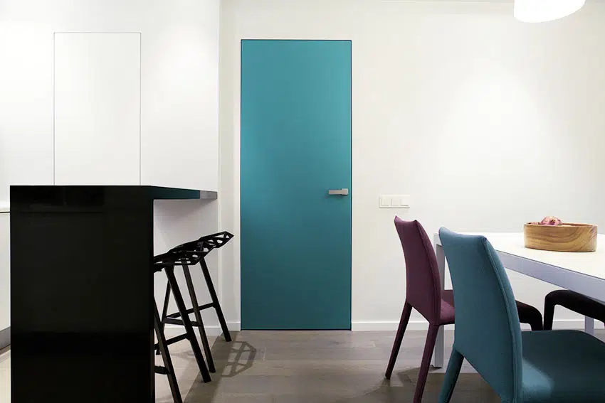 Hinged teal soundproof door with white wall counter table with stool ss