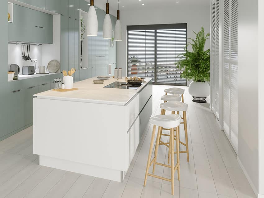 Kitchen with white counter and stools black blinds white pendant lights teal cabinets green plant