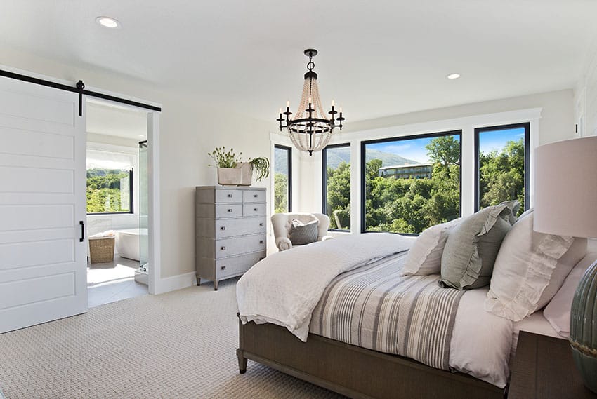 Master bedroom with bathroom glass window barndoor chandelier