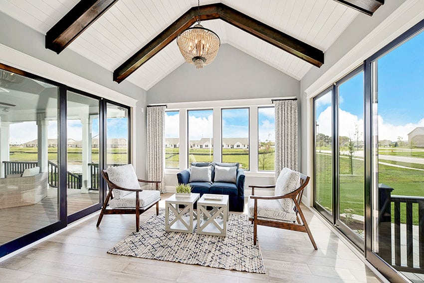 Sunroom with sliding glass doors cathedral ceiling chandelier is