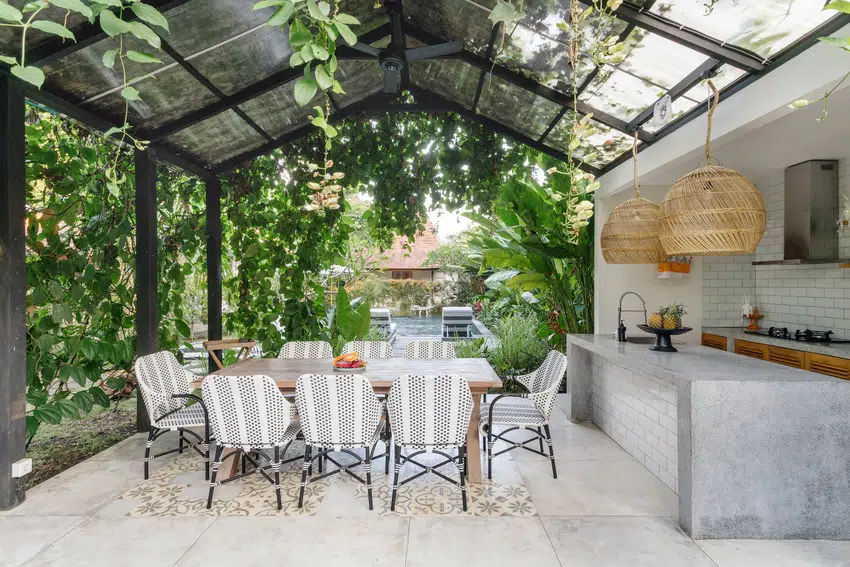 Aluminum covered patio with table chairs and outdoor kitchen 