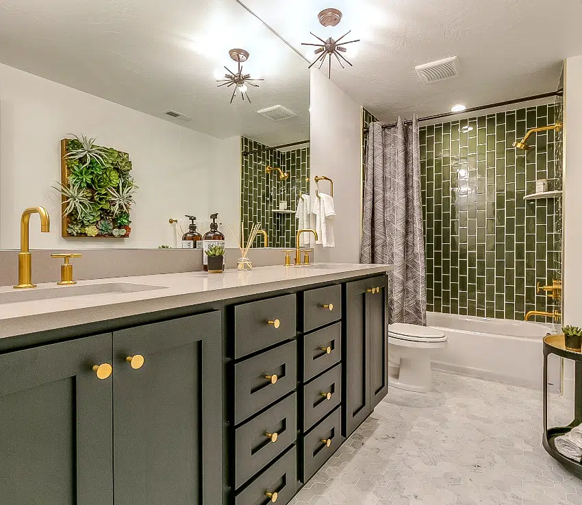 beautiful bathroom with green tile accessory shower wall green drawers a brass faucets and fixtures