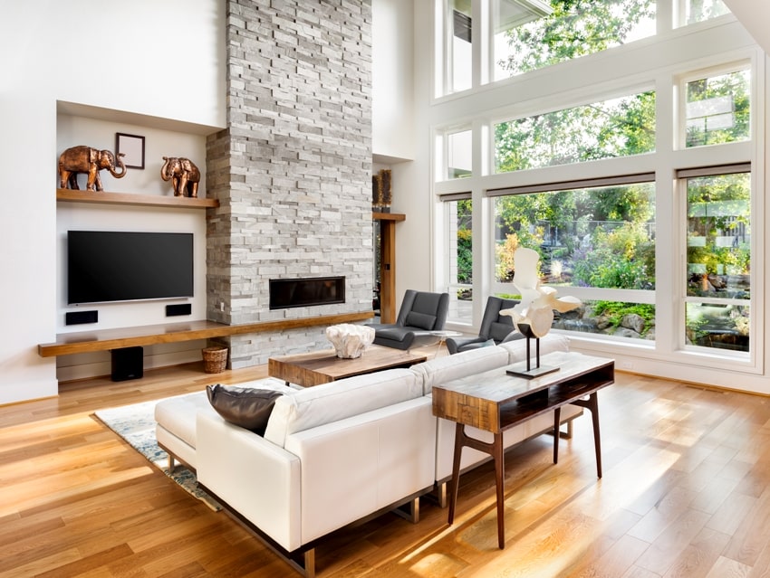beautiful living room interior with honey oak wood floors furniture and fireplace