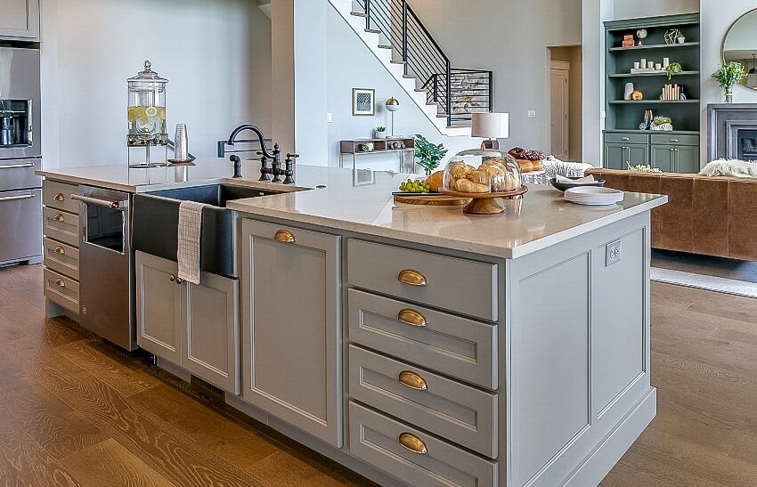 Beautiful modern kitchen with gray kitchen island and wooden floors