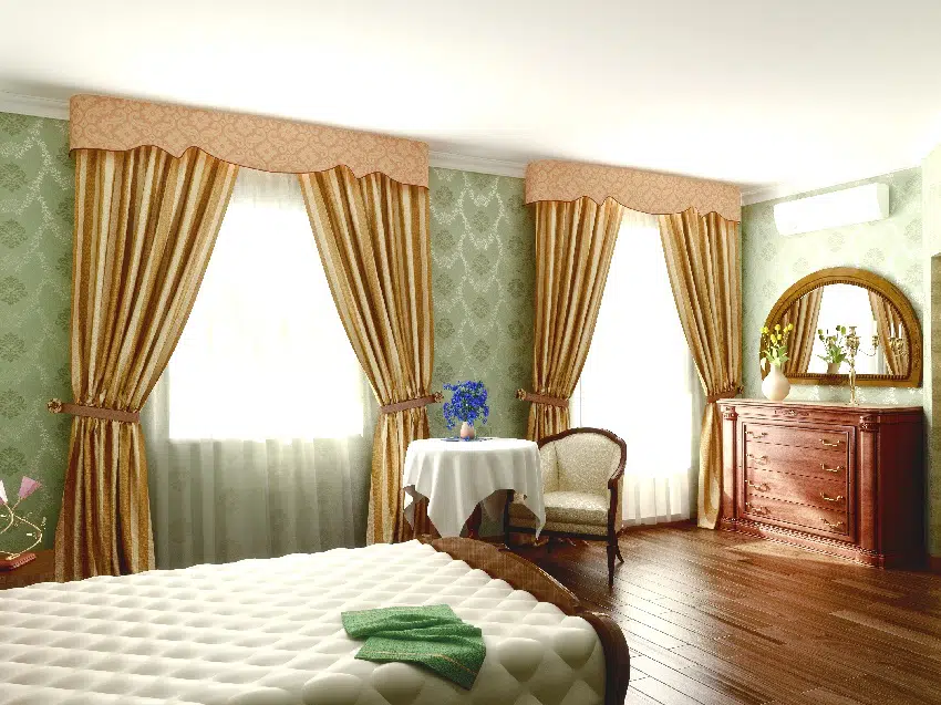 Bedroom with gold tie up curtains 